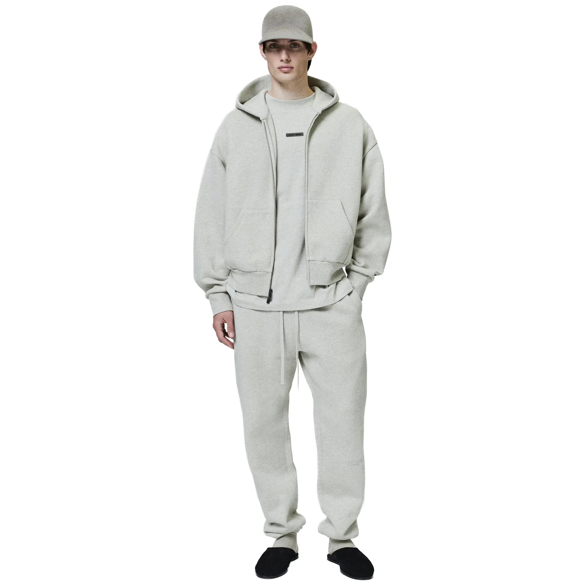 Front Model View of Fear Of God Essentials Classic Heather Stone Zip-Up Hoodie (SS25) 192SP254782F